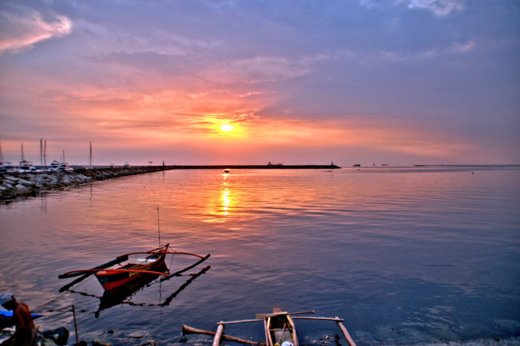 The Pasay Waterfront is a good choice to watch a Sunset over Manila Bay .